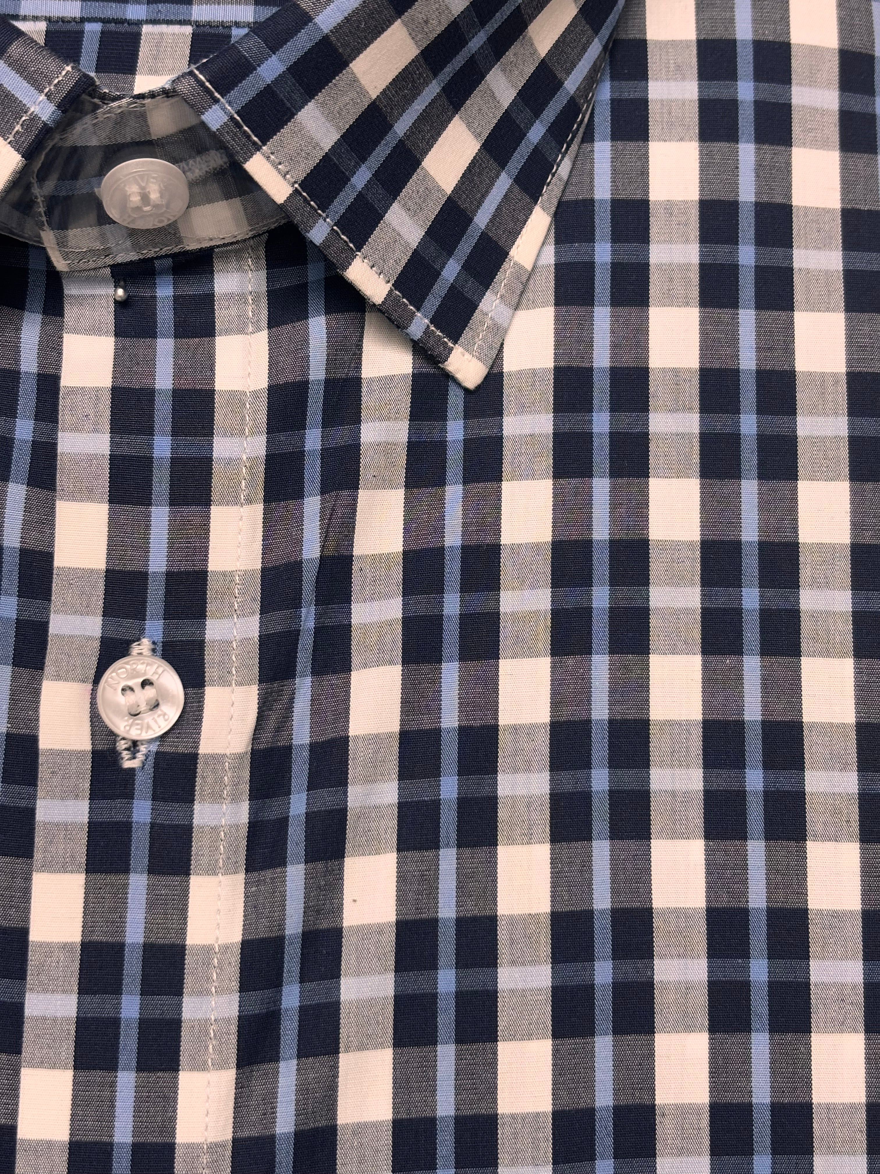 Close-up of a checkered shirt fabric with Blue & Black Tattersall Check pattern